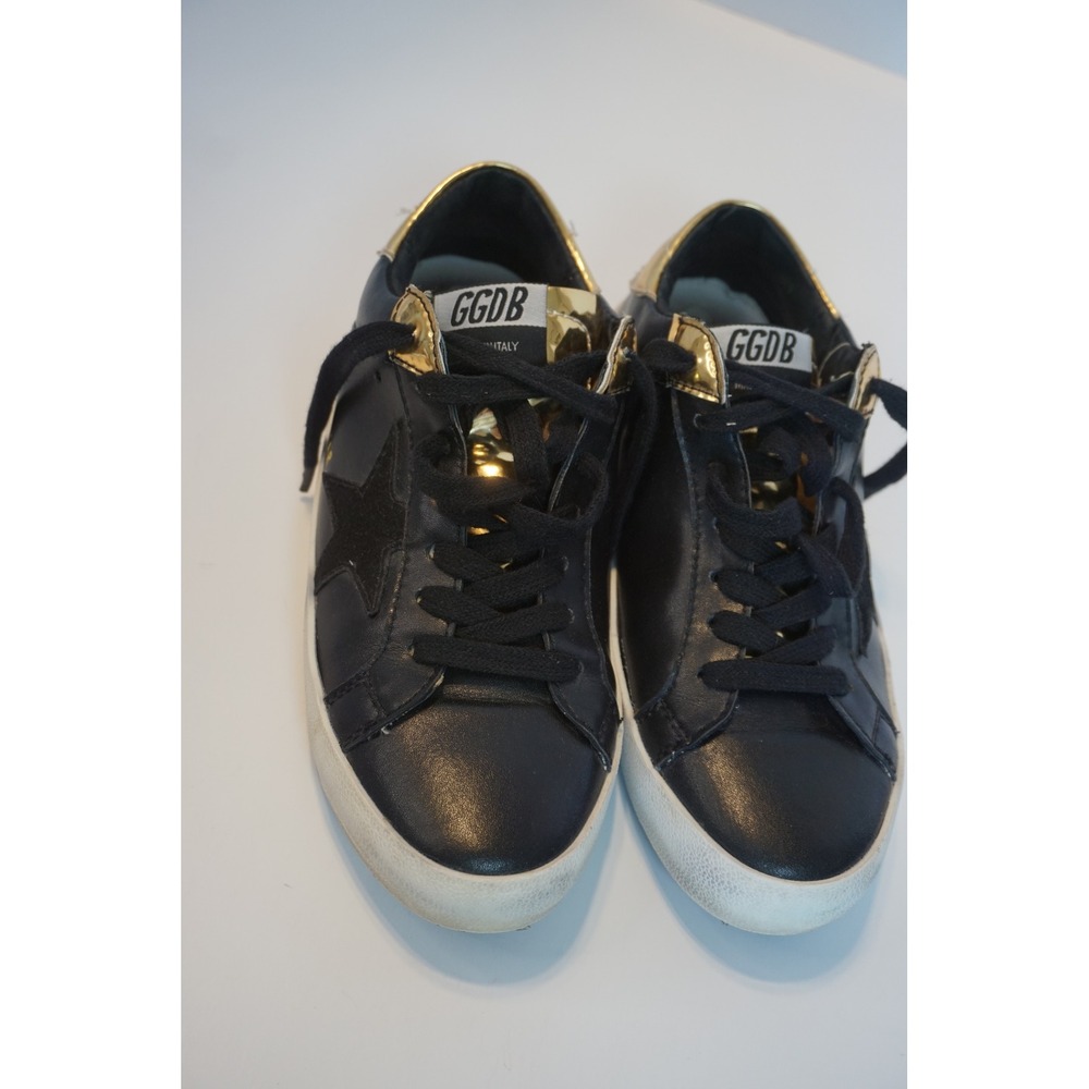 Black Star Low Top Sneakers with Gold Metallic Trim and Lace Up Front